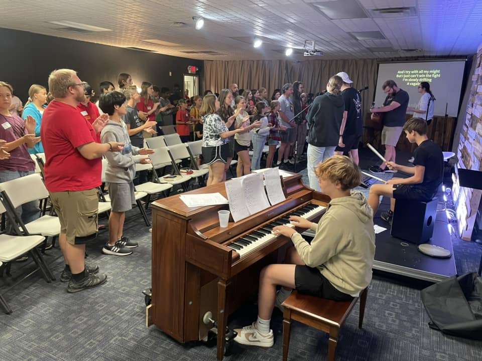 380883181_706051291562951_1754734945347435004_n Students worshiping together