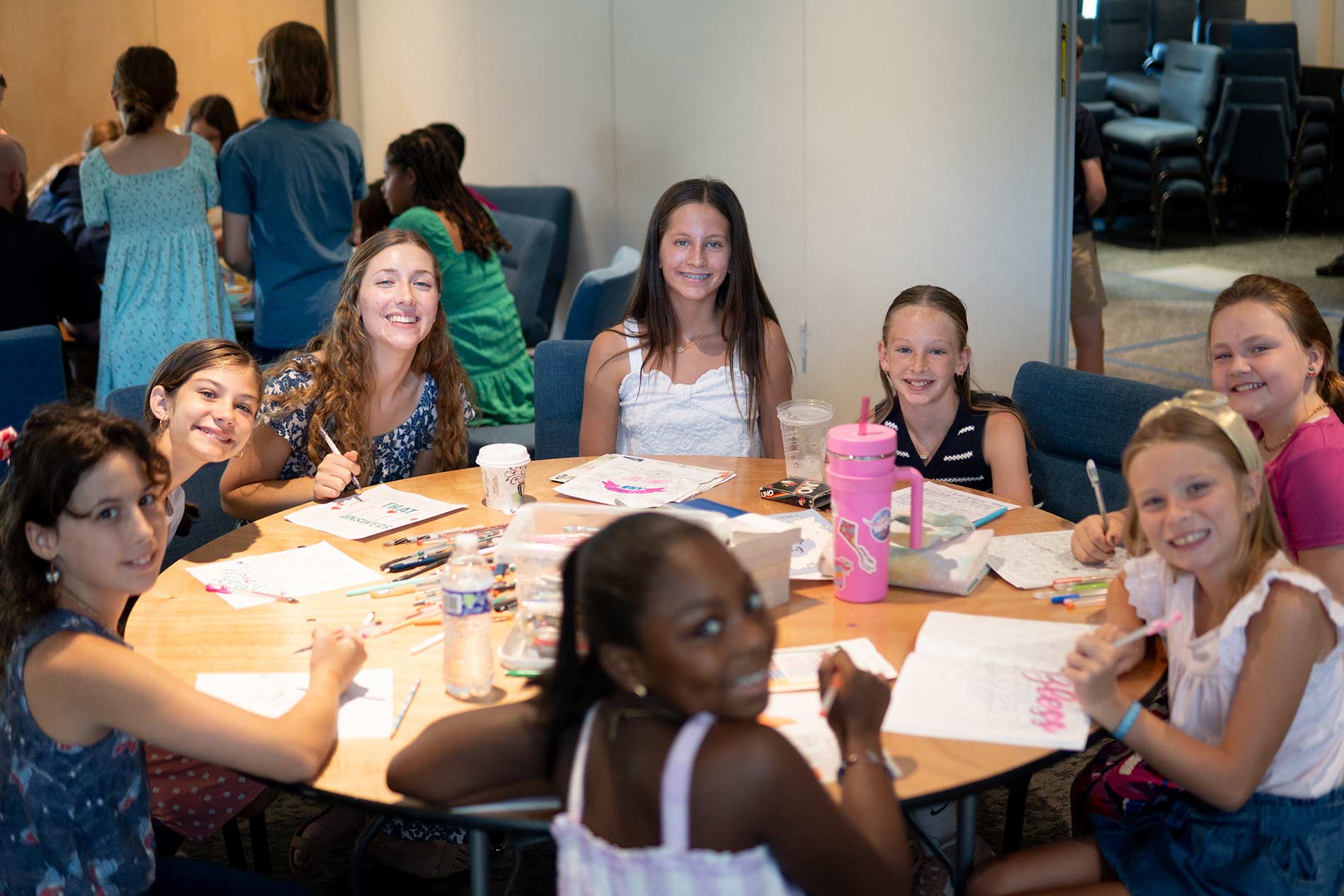 Teens sitting at table