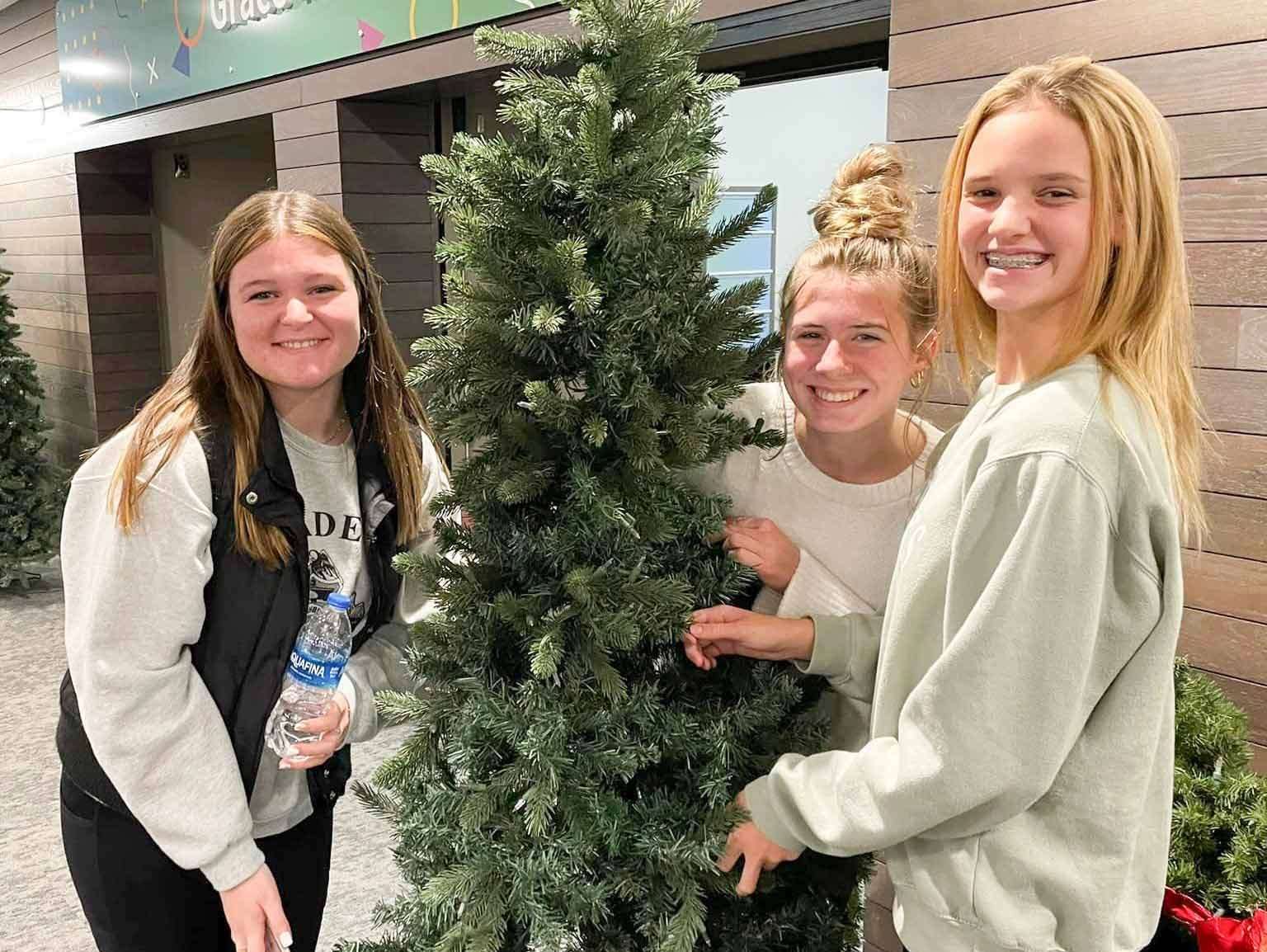 Grade-7-12-special-opportunities copy 2 Student girls decorating Christmas tree