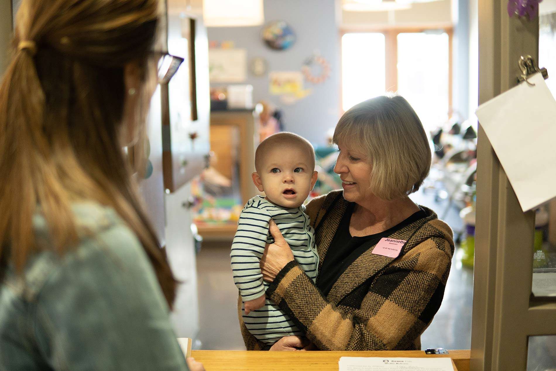 Infants-Toddlers-Twos Woman holding baby