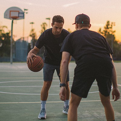 Local Witness Teams - Web - Activity Thumbnail 02 Two men playing basketball outside