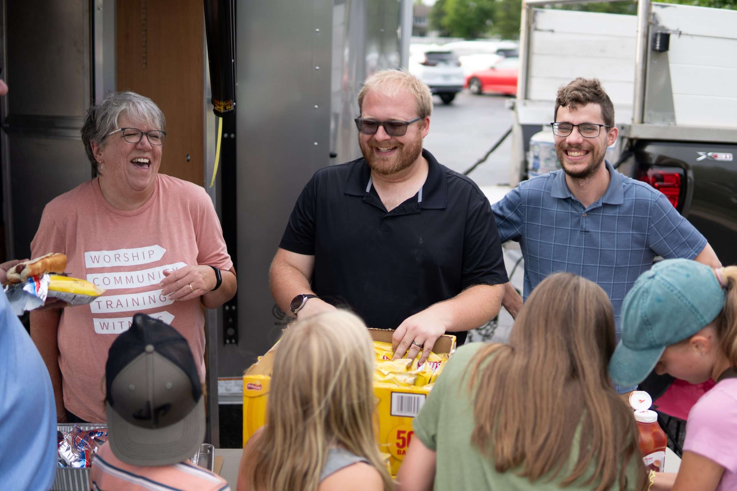 Outdoor Baptism Church members volunteering together