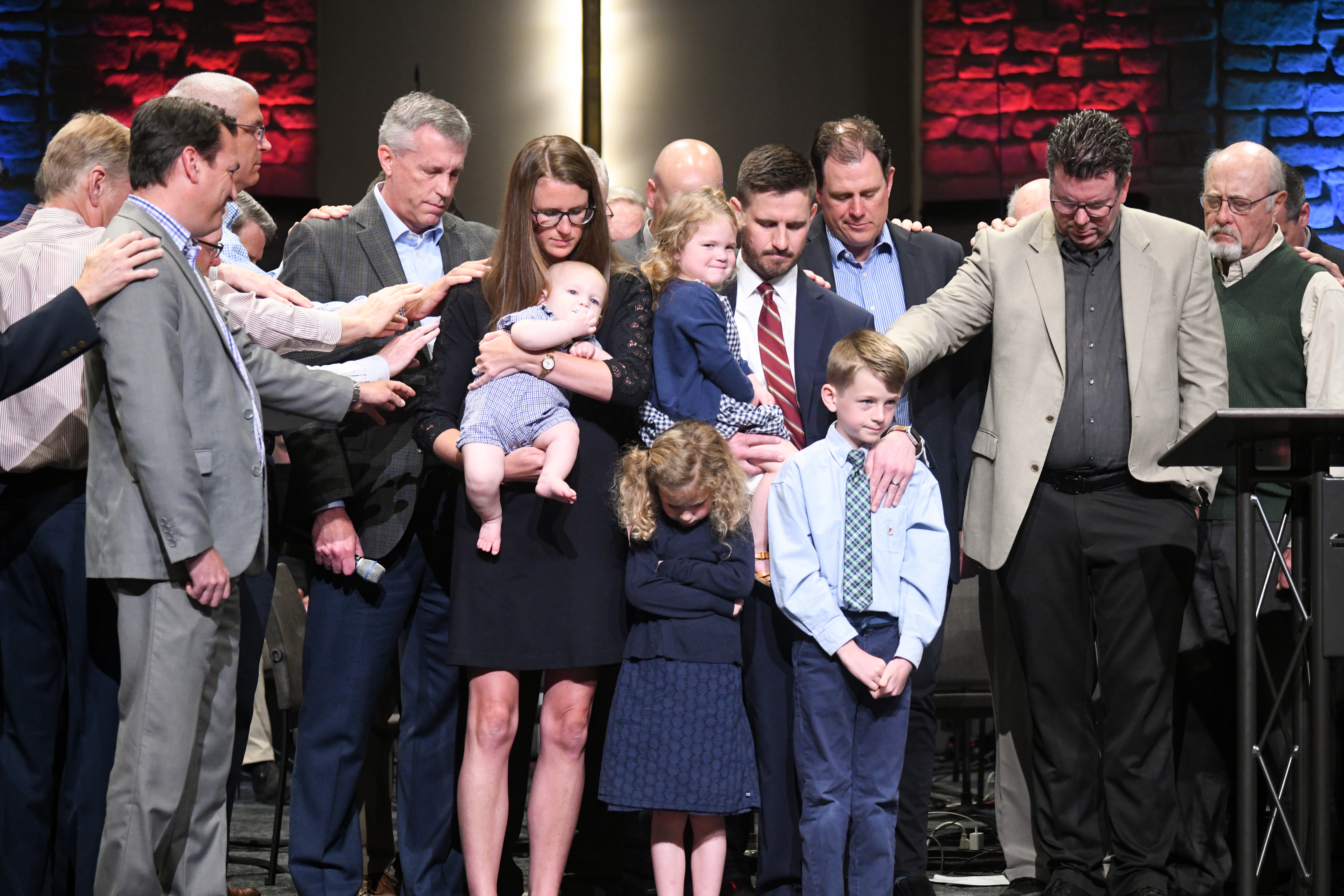 Pastor Zac Installation-055 Pastor Zac Hess installed. People on stage praying.