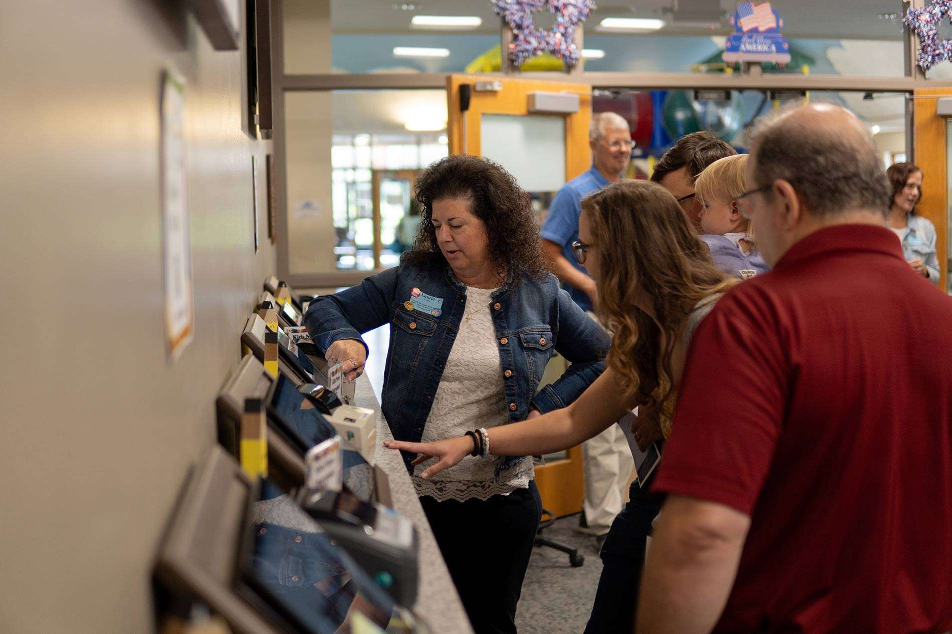 Woman stacking items as a volunteer at church