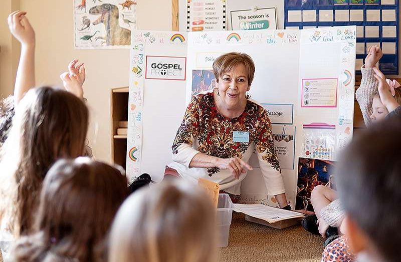 Woman teaching children