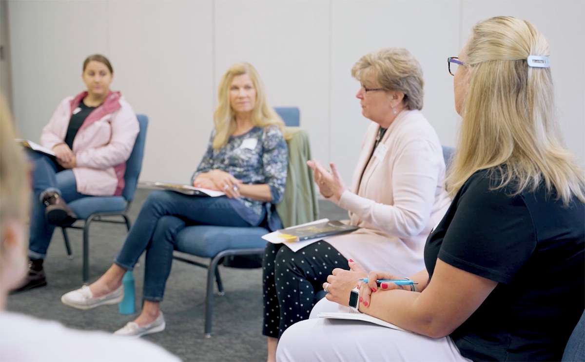womens-ministry Woman leading a group of women at a Bible study